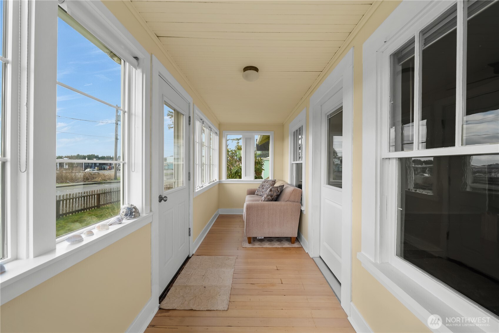 212 2nd Street Northeast Long Beach, WA 98631 - Photo 4 of 33 a living room with furniture and large windows