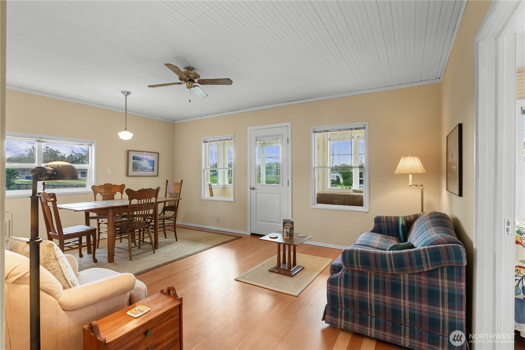 212 2nd Street Northeast Long Beach, WA 98631 - Photo 5 of 33 a living room with furniture a wooden floor and a window