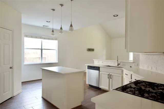 a large bathroom with a sink a large mirror and a bathtub