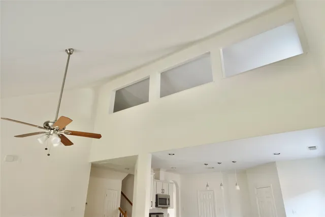 a view of a hallway with a fan