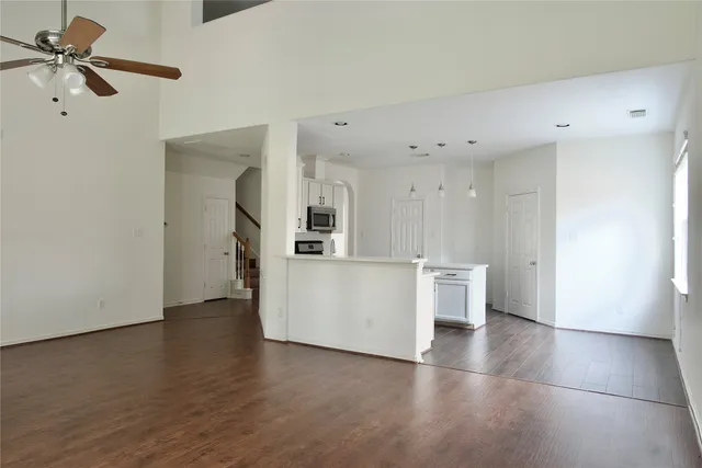 a view of a kitchen with wooden floor