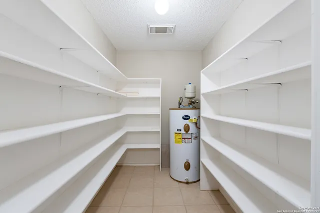 a stove top oven sitting inside of a kitchen