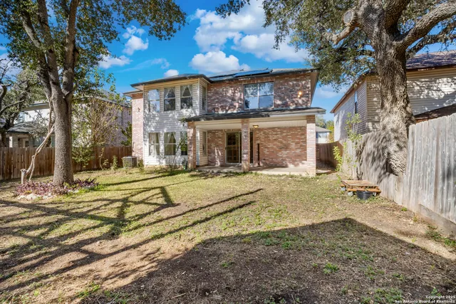 a swimming pool with outdoor seating