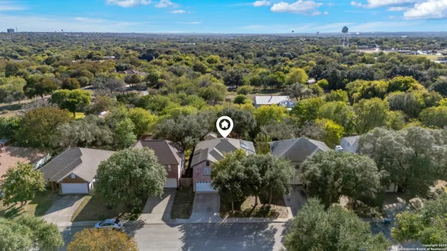 an aerial view of a house with outdoor space