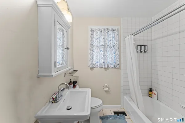 a bathroom with a sink a toilet and a bathtub