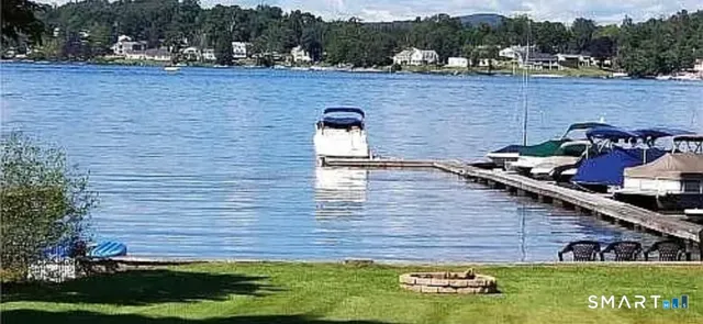 a view of a backyard with swimming pool