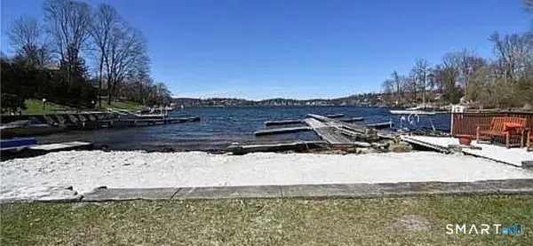 a view of a swimming pool with a table and chairs