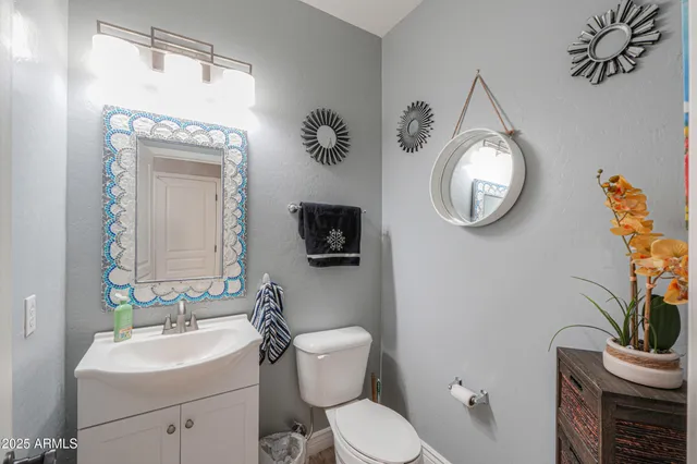 a spacious bathroom with a double vanity sink and a mirror
