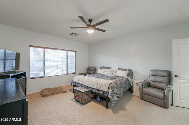 a view of a hallway with closet and cabinet