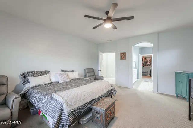 a bedroom with furniture and a wooden floor