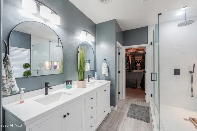 a view of a hallway with closet and a window