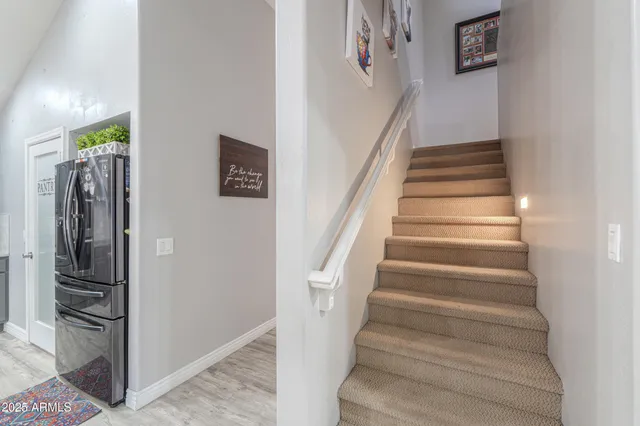 a bedroom with furniture and a flat screen tv