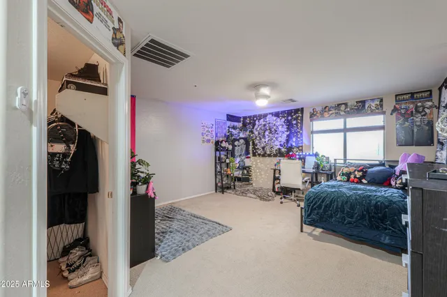a view of a hallway with a table and chairs