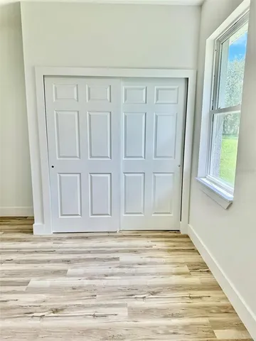 a view of wooden floor with entryway