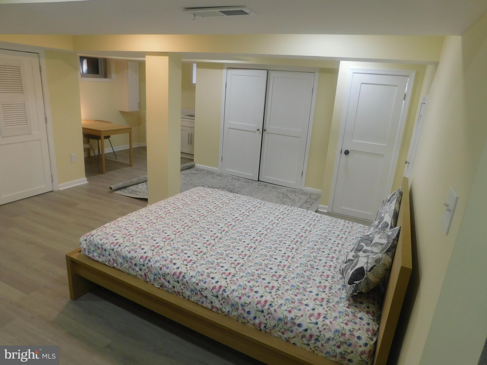 5600 11th Street North Arlington, VA 22205 - Photo 12 of 34 a bedroom with a bed and wooden floor