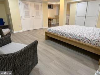 5600 11th Street North Arlington, VA 22205 - Photo 16 of 34 a bedroom with a bed and wooden floor