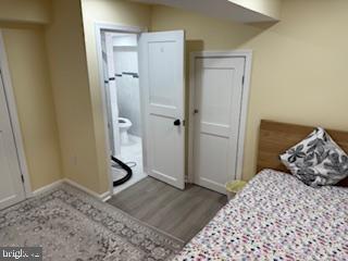 5600 11th Street North Arlington, VA 22205 - Photo 19 of 34 a bedroom with a bed and wooden floor