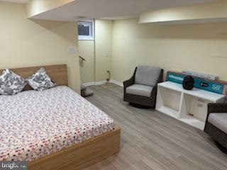 5600 11th Street North Arlington, VA 22205 - Photo 20 of 34 a bedroom with a bed and a couch