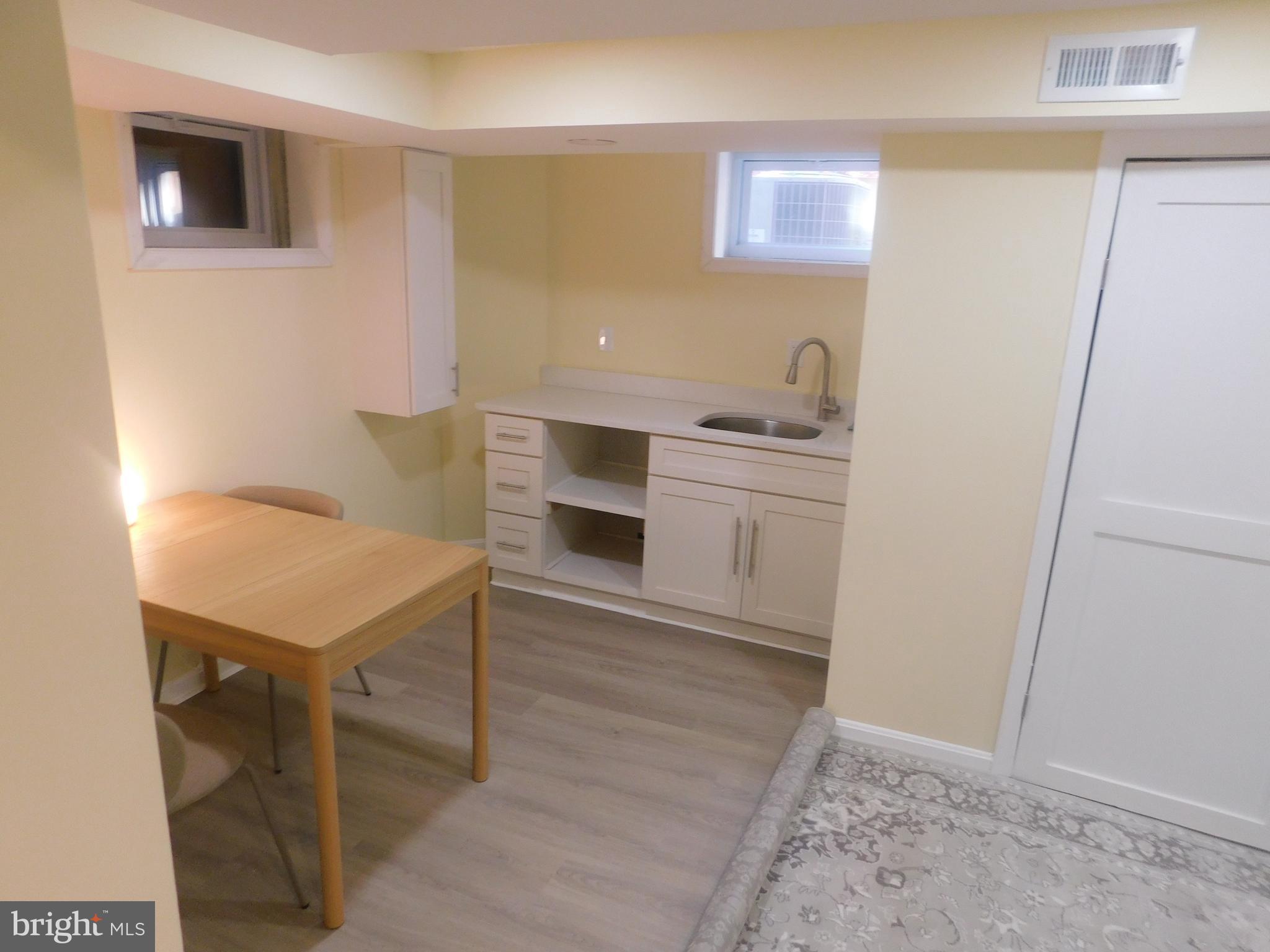 5600 11th Street North Arlington, VA 22205 - Photo 21 of 34 a room with furniture and a wooden floor