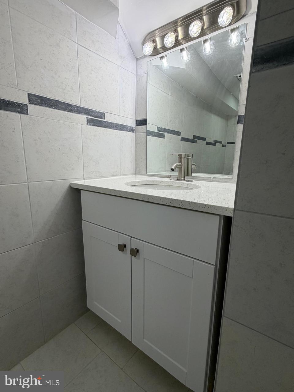 5600 11th Street North Arlington, VA 22205 - Photo 28 of 34 a bathroom with a sink and mirror