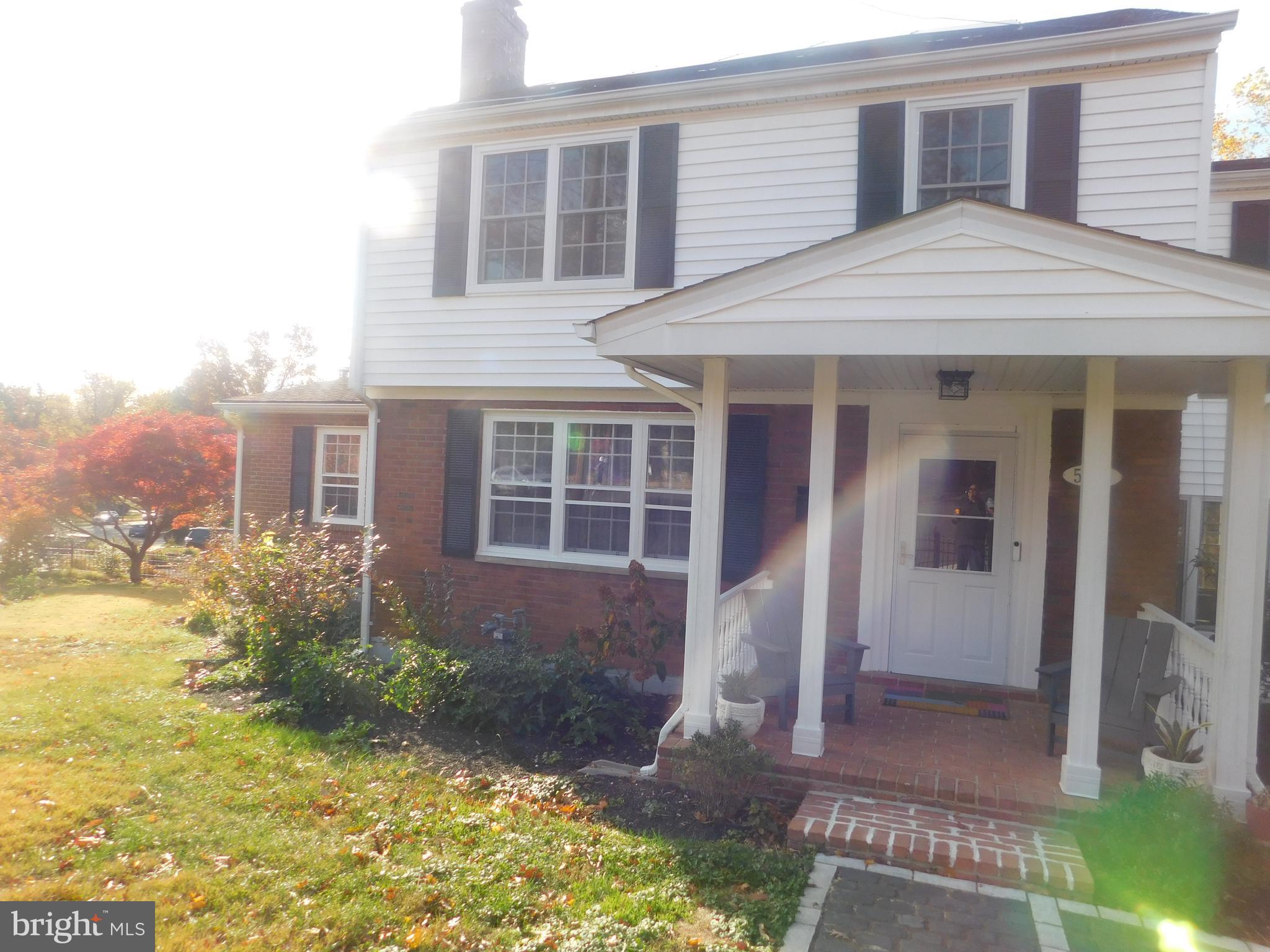 5600 11th Street North Arlington, VA 22205 - Photo 3 of 34 a front view of a house with garden