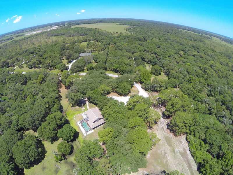 5017 Vanderipe Road Sarasota, FL 34241 - Photo 23 of 25 Aerial View - This aerial view shows the wide conservation easement that is to the north of the property.