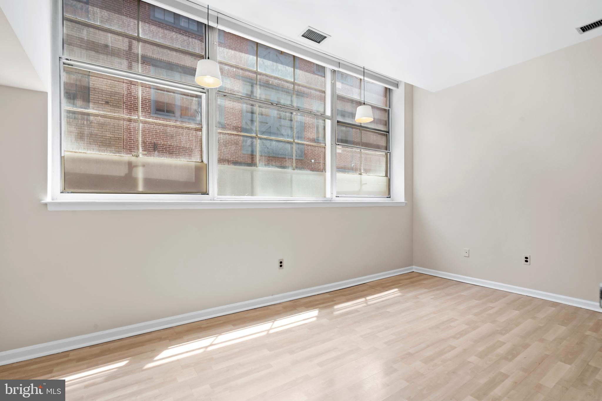 136 North Bread Street, Unit 130 Philadelphia, PA 19106 - Photo 15 of 31 a view of an empty room with a window