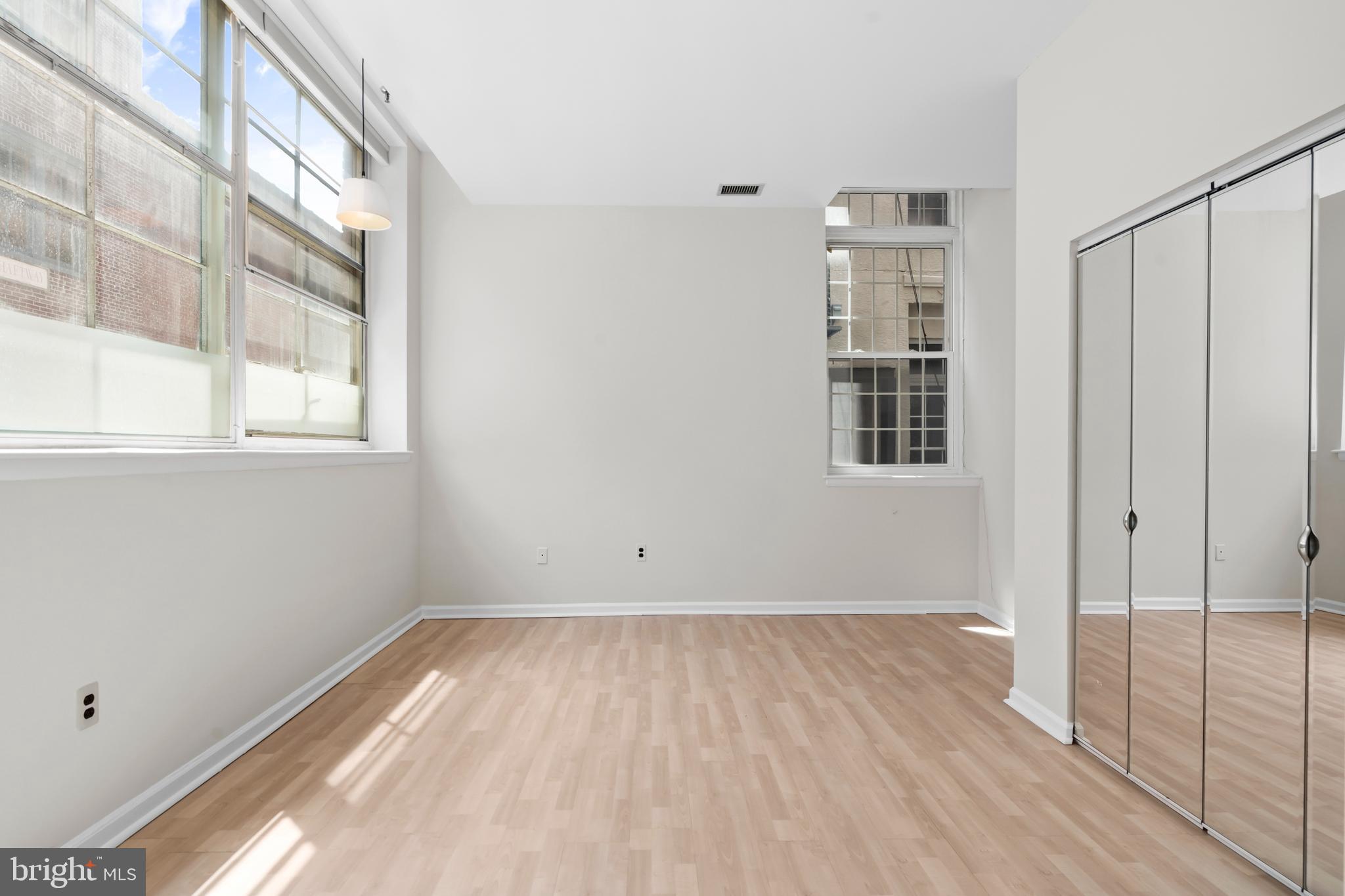 136 North Bread Street, Unit 130 Philadelphia, PA 19106 - Photo 16 of 31 a view of empty room with wooden floor and fan