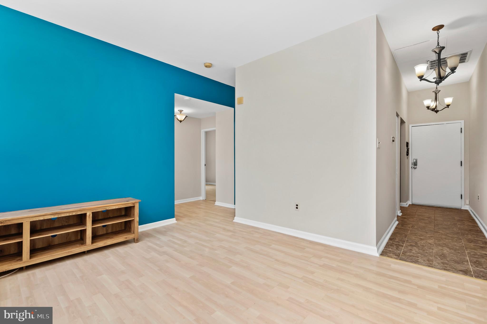 136 North Bread Street, Unit 130 Philadelphia, PA 19106 - Photo 3 of 31 a view of an empty room with wooden floor and windows