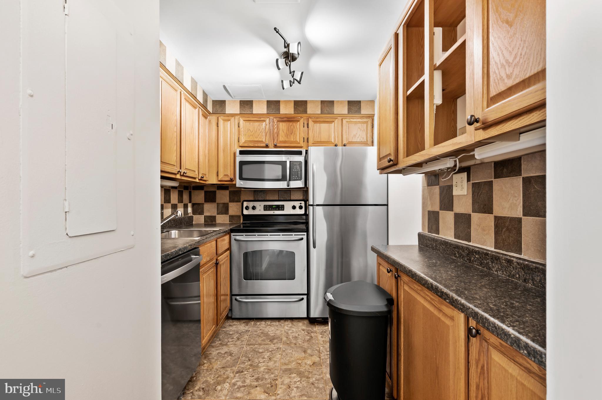136 North Bread Street, Unit 130 Philadelphia, PA 19106 - Photo 7 of 31 a kitchen with a refrigerator and a sink