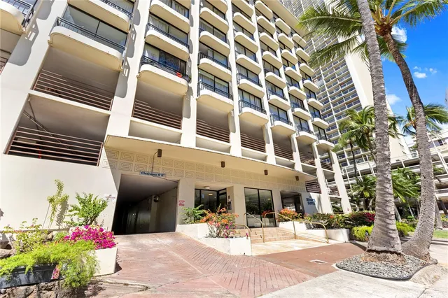 a view of a building with sitting area