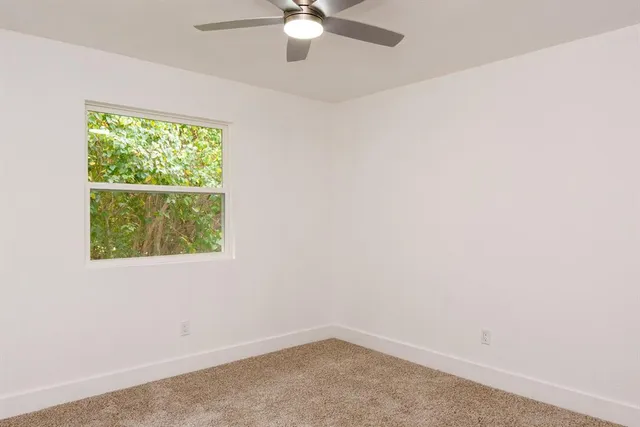 a bathroom with a shower and a sink