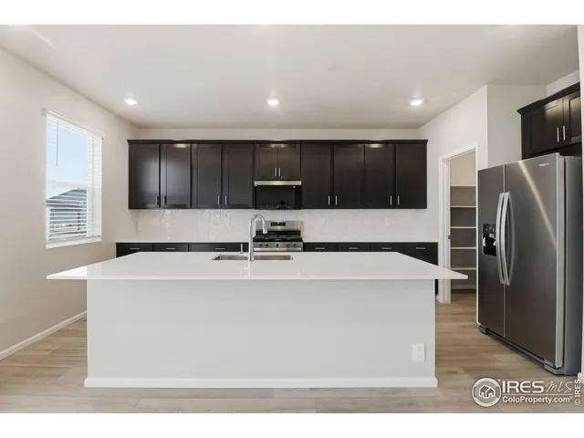 a bathroom with a sink vanity and a mirror