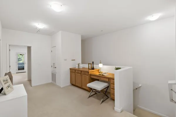 a bedroom with bed and a large mirror