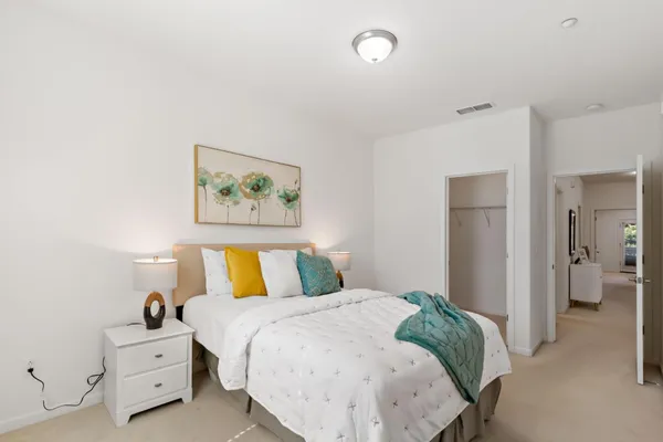 a bedroom with a bed and a table