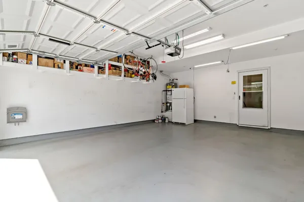 front view of a building with a garden