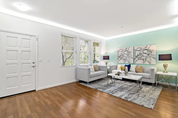 a view of a livingroom with an empty space and a fireplace