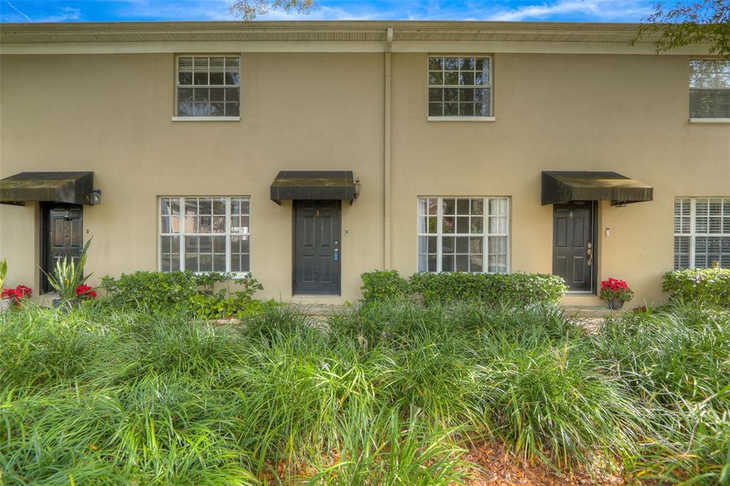 408 South Arrawana Avenue, Unit A3 Tampa, FL 33609 - Photo 1 of 1 a front view of a house with a yard