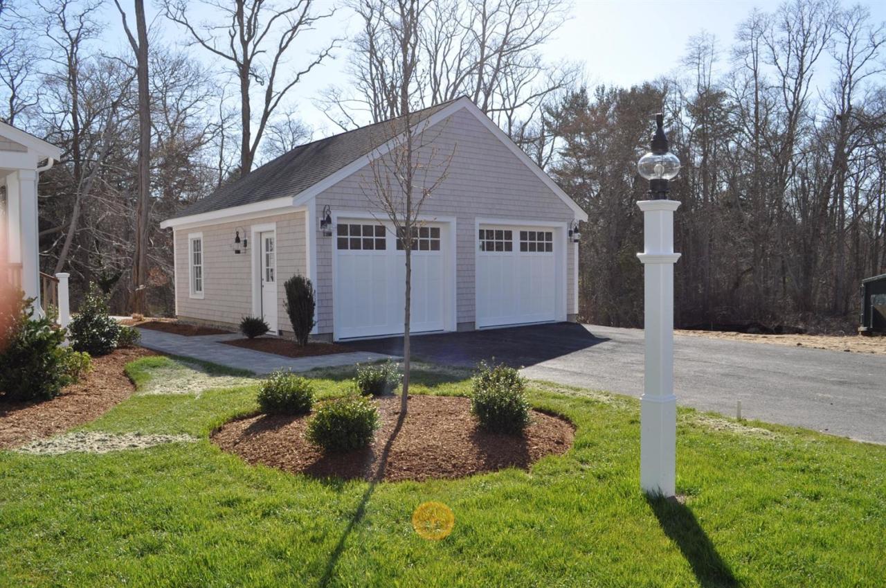 80 County Road, Unit 3 North Falmouth, MA 02556 - Photo 3 of 17 a view of a house with backyard and sitting area