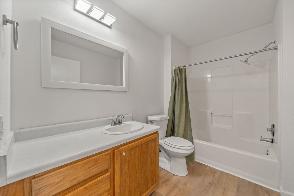 1804 Singleton Avenue Austin, TX 78702 - Photo 19 of 36 a bathroom with a sink a toilet and a bathtub