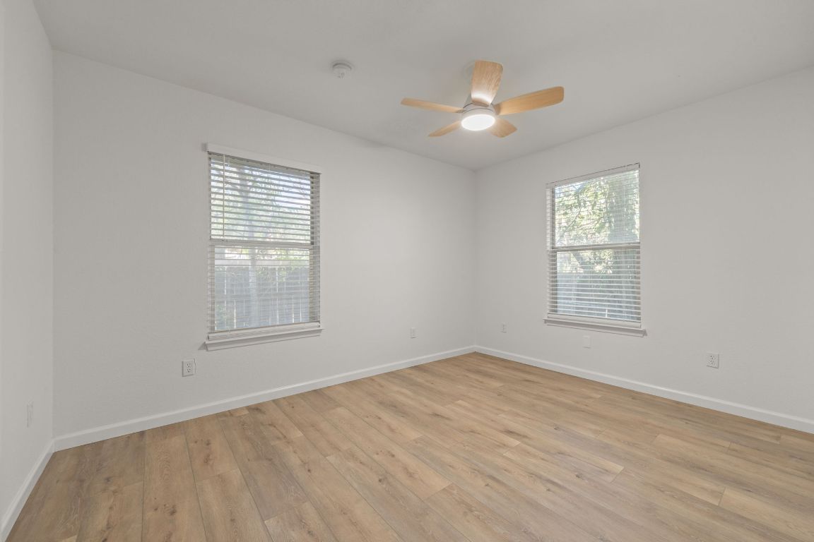 1804 Singleton Avenue Austin, TX 78702 - Photo 20 of 36 a view of an empty room with wooden floor and a window