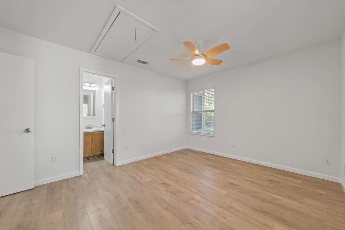 1804 Singleton Avenue Austin, TX 78702 - Photo 26 of 36 wooden floor in an empty room with a window