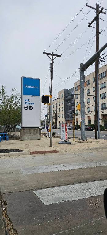 1804 Singleton Avenue Austin, TX 78702 - Photo 34 of 36 a street sign on a sidewalk next to a road
