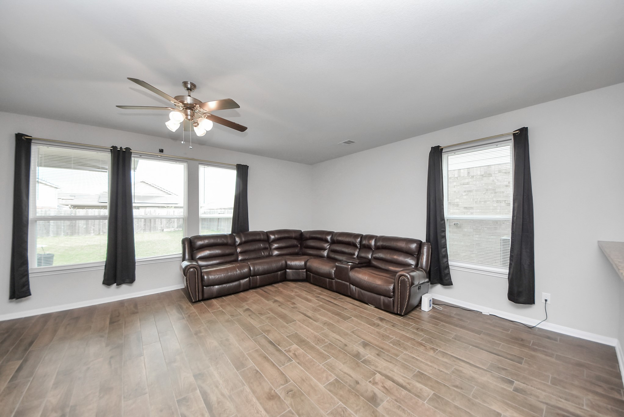 4239 Wyanngate Drive Spring, TX 77373 - Photo 11 of 36 a living room with furniture window and wooden floor