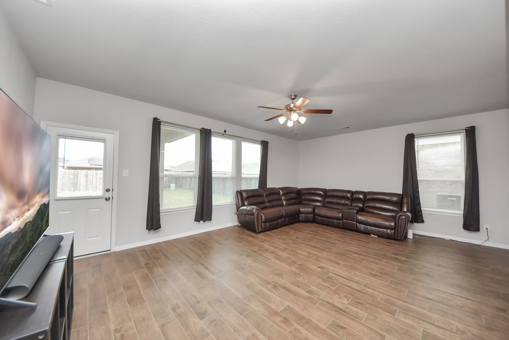 4239 Wyanngate Drive Spring, TX 77373 - Photo 13 of 36 a spacious bedroom with a bed and a large window