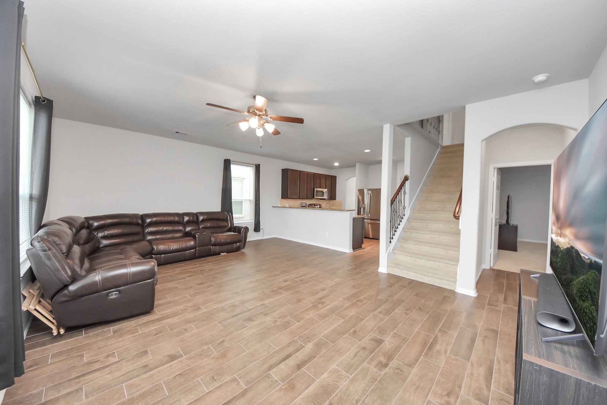 4239 Wyanngate Drive Spring, TX 77373 - Photo 14 of 36 a living room with furniture and a flat screen tv