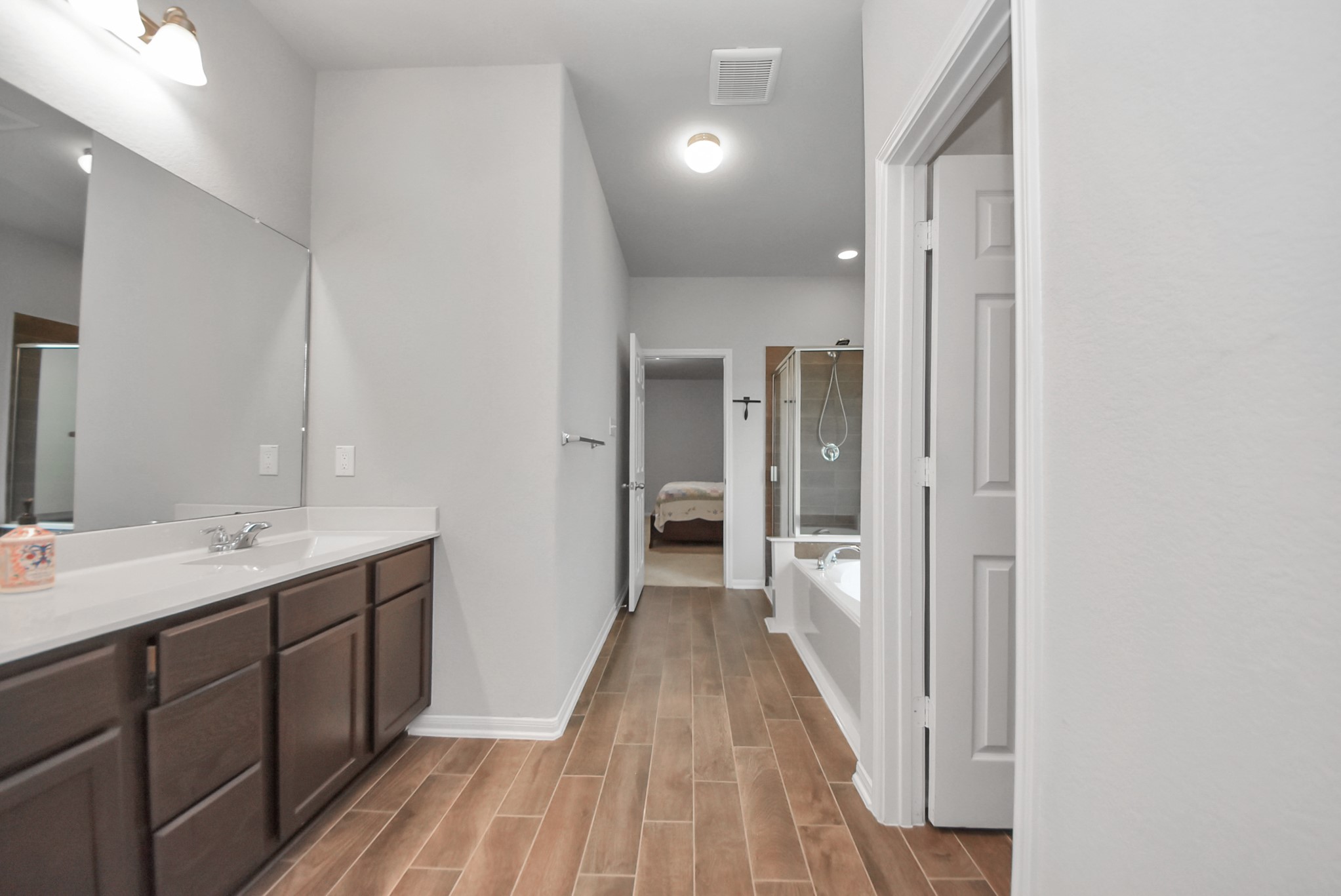 4239 Wyanngate Drive Spring, TX 77373 - Photo 21 of 36 a bathroom with a sink and mirror