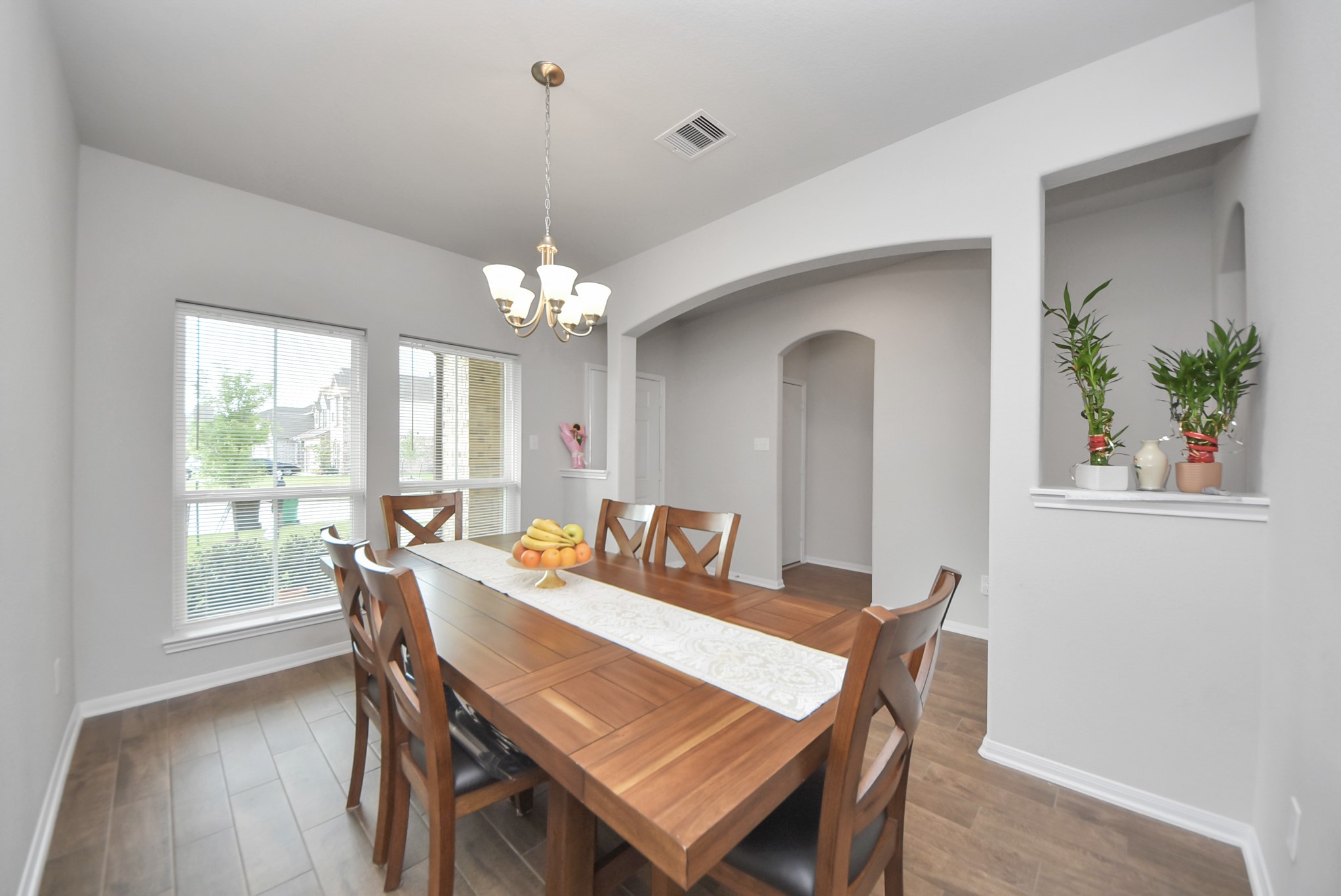 4239 Wyanngate Drive Spring, TX 77373 - Photo 5 of 36 a view of a dining room with furniture window and wooden floor