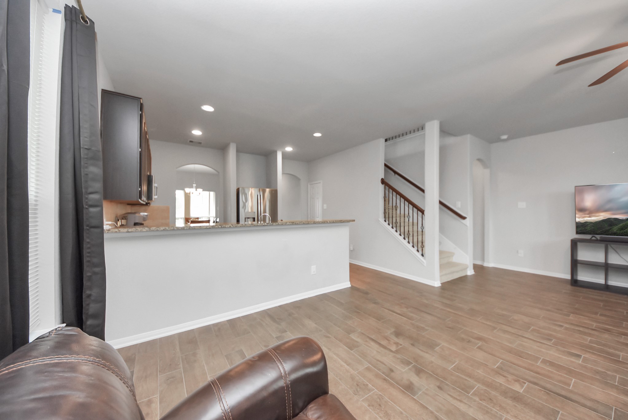 4239 Wyanngate Drive Spring, TX 77373 - Photo 10 of 36 a view of kitchen with furniture and wooden floor