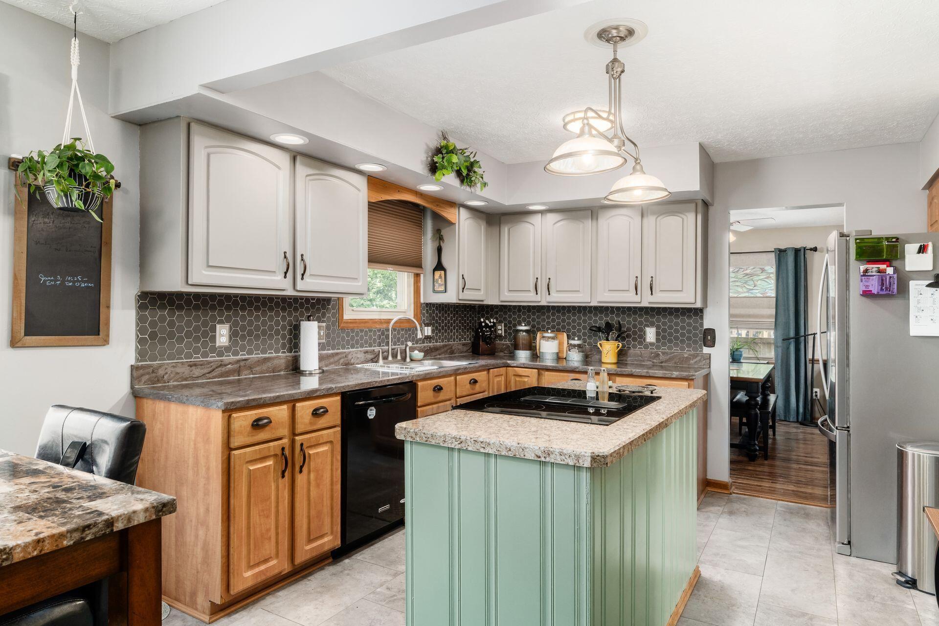 631 Brice Road Columbus, OH 43213 - Photo 18 of 45 Ample cabinetry, ceramic tile backsplash